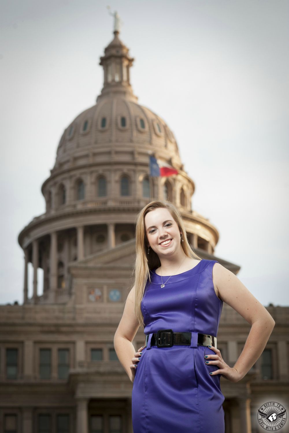 Austin senior photography at the Texas State Capitol of girl in purple fancy dress